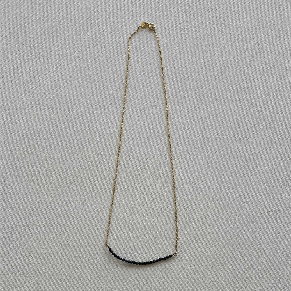 Elegant Gold and Black Necklace